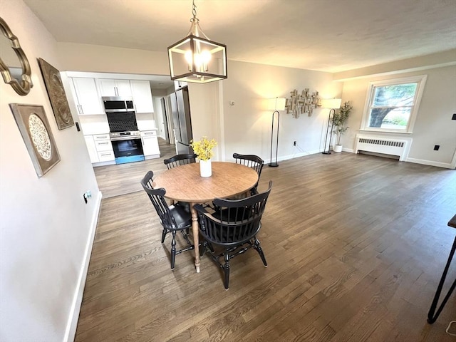 3 Rosewood Dr, Worcester, MA 01602 - dining space featuring radiator and dark wood finished floors