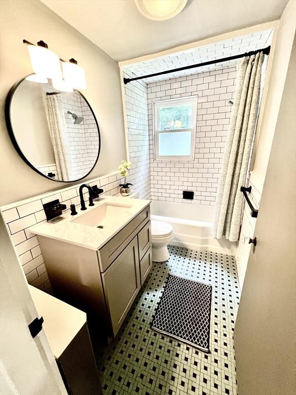 3 Rosewood Dr, Worcester, MA 01602 - full bath featuring vanity, tile walls, shower / tub combo, and tile patterned floors