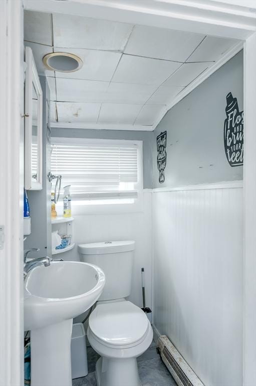 14 Sutton Ave, Oxford, MA 01540 - half bath with a wainscoted wall, toilet, and baseboard heating