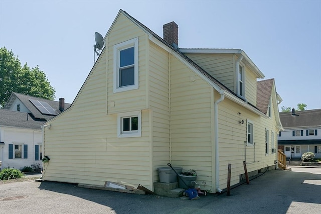 14 Sutton Ave, Oxford, MA 01540 - rear view of house with a chimney