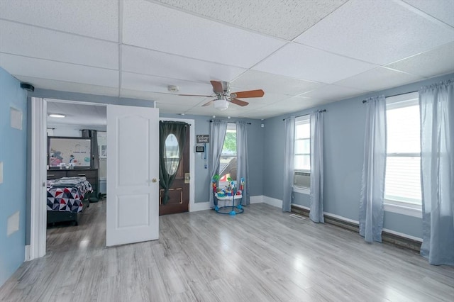 14 Sutton Ave, Oxford, MA 01540 - empty room with a ceiling fan, a drop ceiling, light wood finished floors, and baseboards