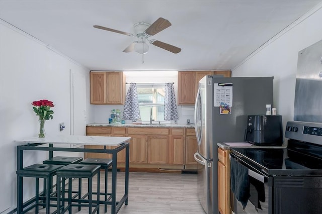 14 Sutton Ave, Oxford, MA 01540 - kitchen featuring stainless steel electric stove, a sink, ceiling fan, light wood-type flooring, and crown molding