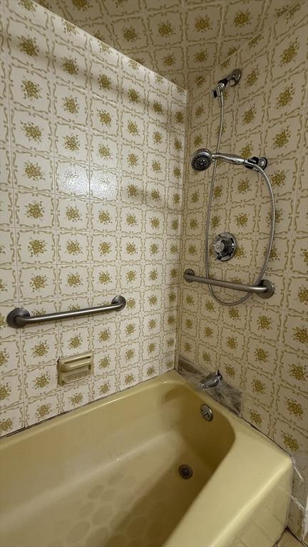 full bath featuring  shower combination