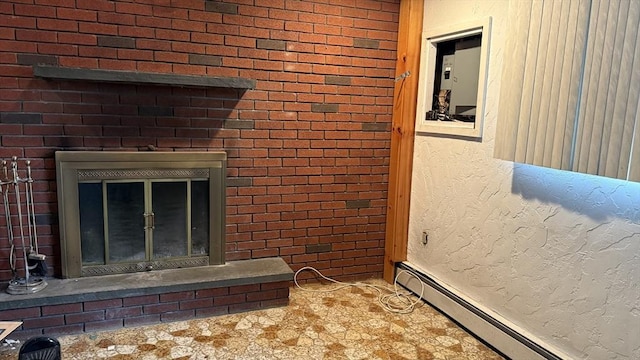 detailed view of a baseboard radiator and a glass covered fireplace