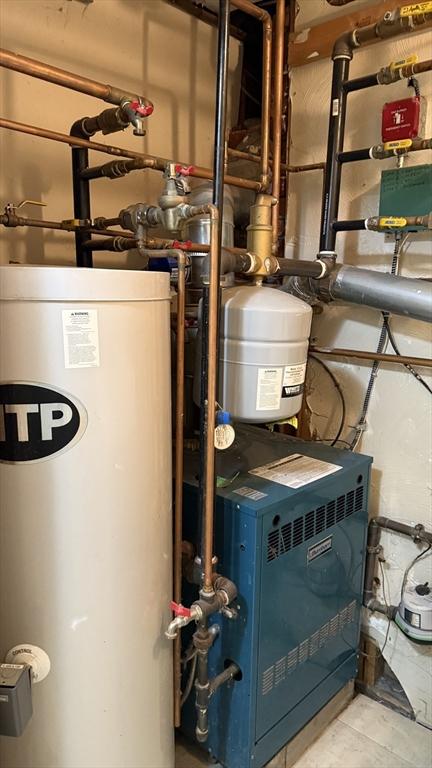 utilities with gas water heater and a heating unit