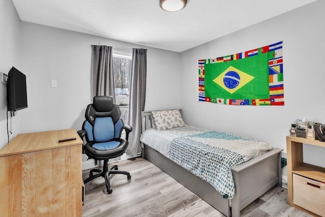 bedroom featuring wood finished floors