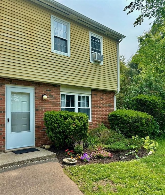 252 W St Unit 18, Amherst, MA 01002 - entrance to property with brick siding and cooling unit