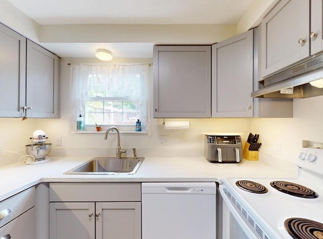 252 W St Unit 18, Amherst, MA 01002 - kitchen with white appliances, a sink, exhaust hood, and gray cabinetry