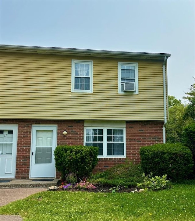 252 W St Unit 18, Amherst, MA 01002 - view of front of house with brick siding and a front yard
