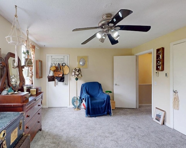 252 W St Unit 18, Amherst, MA 01002 - carpeted bedroom featuring a ceiling fan, baseboards, and a textured ceiling