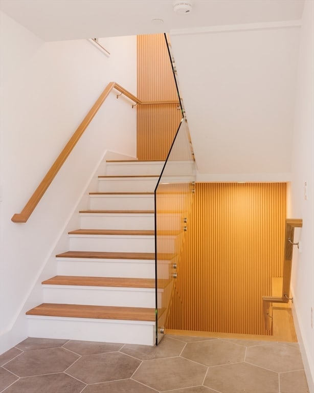 staircase featuring tile patterned floors