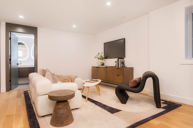 sitting room with light hardwood / wood-style floors