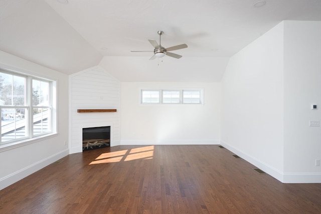 unfurnished living room with ceiling fan, a fireplace, dark hardwood / wood-style floors, and vaulted ceiling