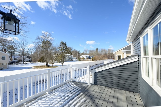 view of snow covered deck