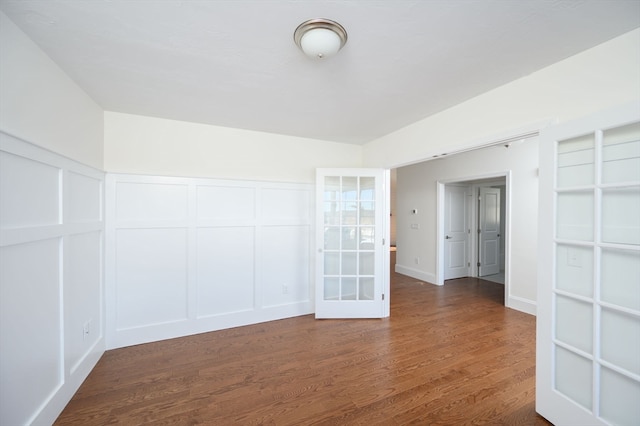 spare room with dark hardwood / wood-style floors