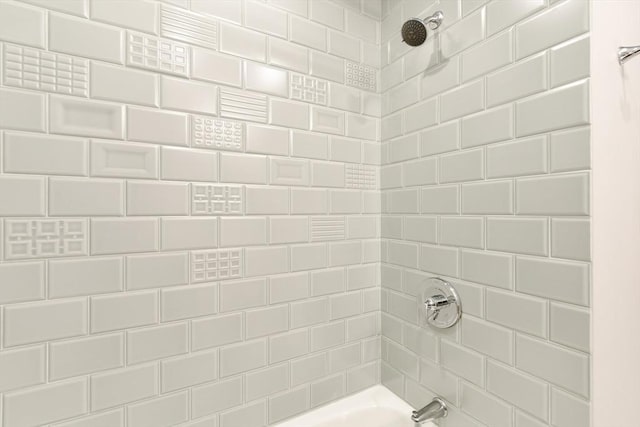 bathroom with shower / tub combination