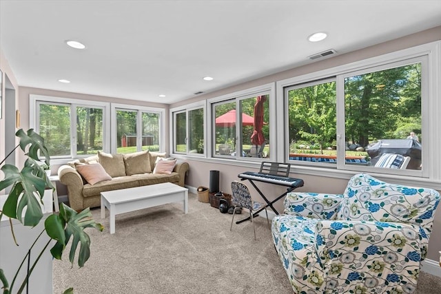 living room featuring carpet flooring and recessed lighting
