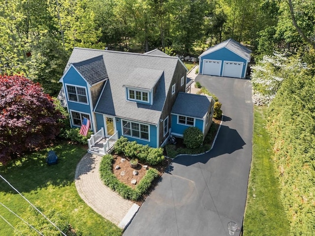 view from above of property with a forest