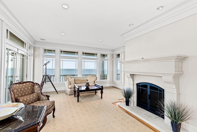 living room featuring a water view and ornamental molding