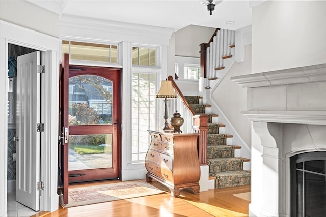 foyer entrance with a healthy amount of sunlight and light wood-type flooring