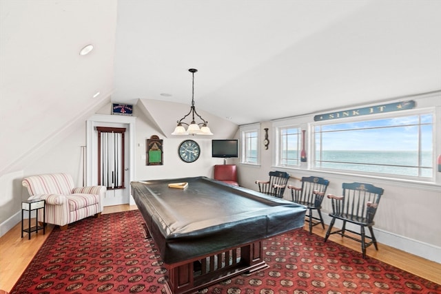 game room with wood-type flooring, vaulted ceiling, and billiards