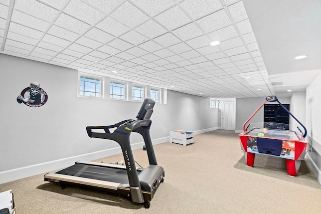 workout area with carpet and a drop ceiling