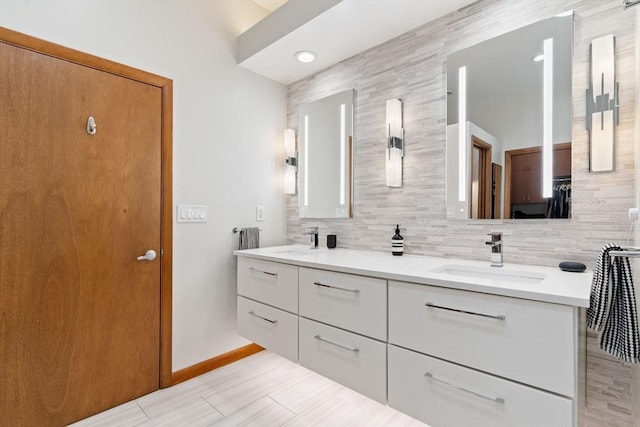 45 Pound St, Medfield, MA 02052 - bathroom with double vanity, tasteful backsplash, baseboards, and recessed lighting