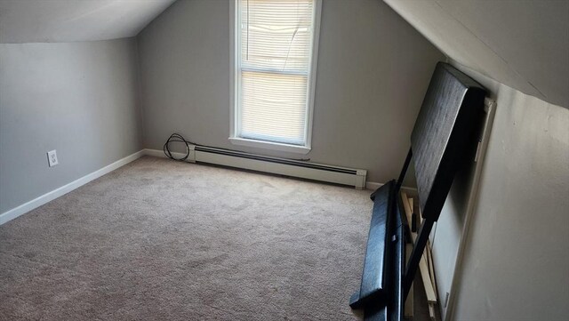 bonus room with baseboard heating, lofted ceiling, carpet flooring, and baseboards