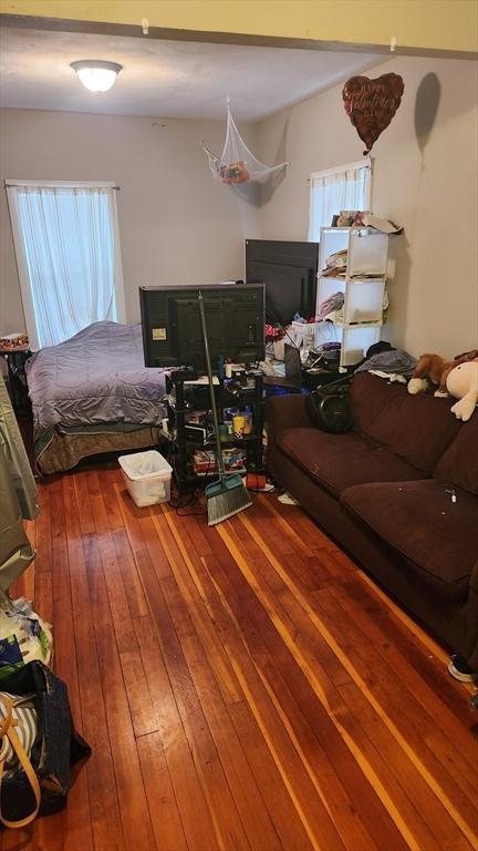 bedroom with hardwood / wood-style floors