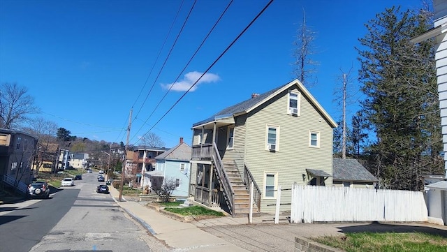 exterior space with stairs and fence