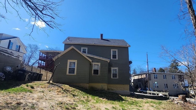 rear view of house with fence