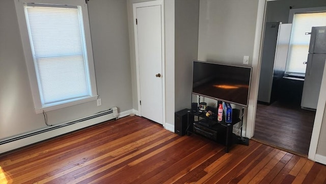 living room with hardwood / wood-style flooring, baseboards, and a baseboard radiator