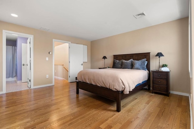 bedroom featuring recessed lighting, visible vents, baseboards, and light wood-style floors