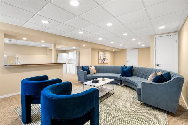 living area with recessed lighting, baseboards, and light carpet