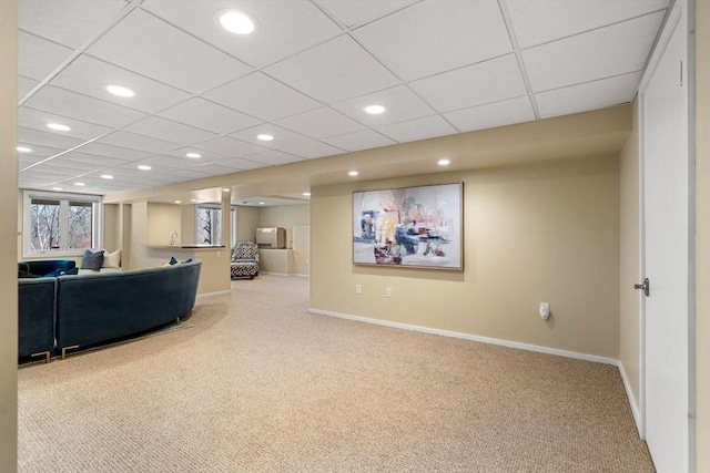 living room featuring recessed lighting, baseboards, a paneled ceiling, and carpet