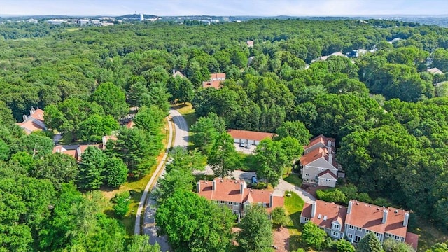 drone / aerial view featuring a view of trees and a residential view