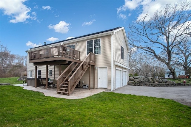 284 Hortonville Rd, Swansea, MA 02777 - back of property with a wooden deck, a garage, a yard, stairway, and driveway
