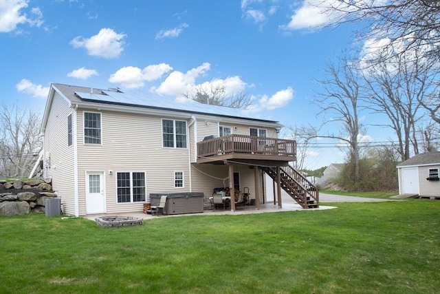 284 Hortonville Rd, Swansea, MA 02777 - rear view of property featuring a hot tub, stairs, a deck, a patio area, and central AC