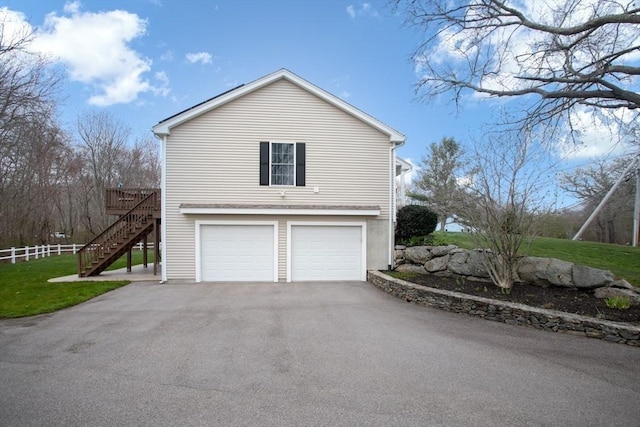 284 Hortonville Rd, Swansea, MA 02777 - view of side of property with stairway, driveway, an attached garage, and fence