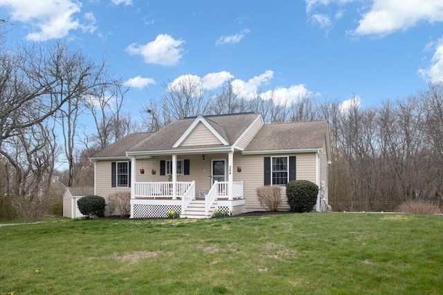284 Hortonville Rd, Swansea, MA 02777 - ranch-style house featuring covered porch, a front yard, a storage unit, and an outbuilding