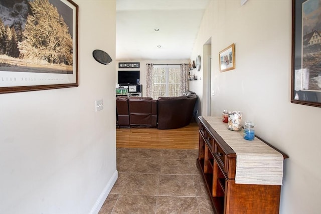 284 Hortonville Rd, Swansea, MA 02777 - hall with dark tile patterned flooring and baseboards