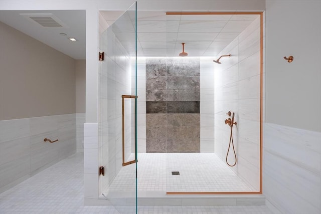 bathroom featuring tile patterned flooring and a shower with shower door