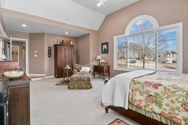 bedroom featuring baseboards, carpet floors, and vaulted ceiling