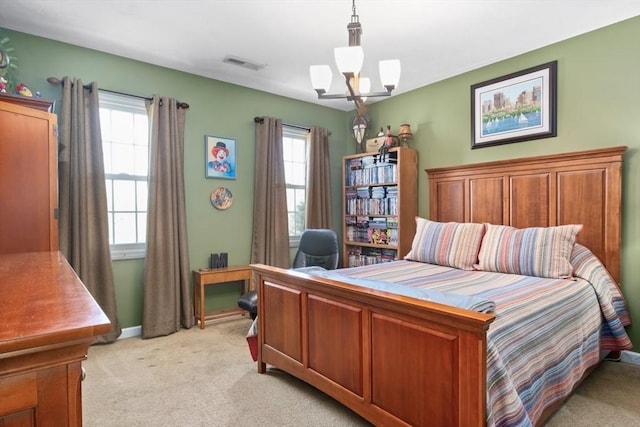 bedroom with visible vents, multiple windows, light colored carpet, and a notable chandelier