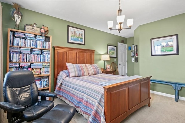 bedroom featuring light colored carpet, baseboards, and a chandelier