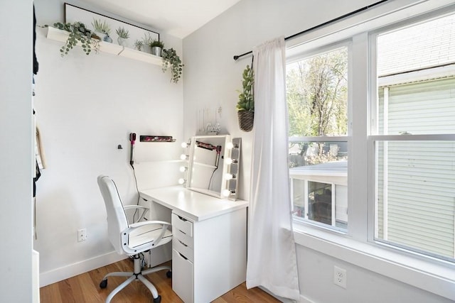 office with light hardwood / wood-style floors