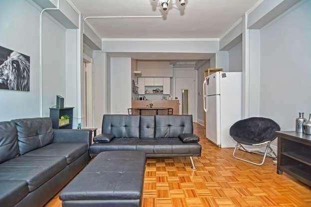 living room featuring ornamental molding and light parquet floors