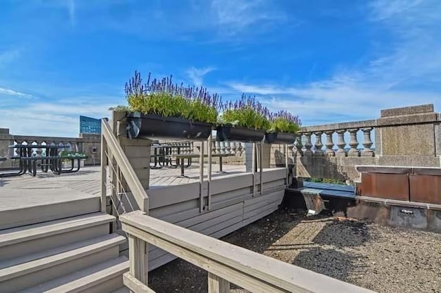 deck featuring a hot tub