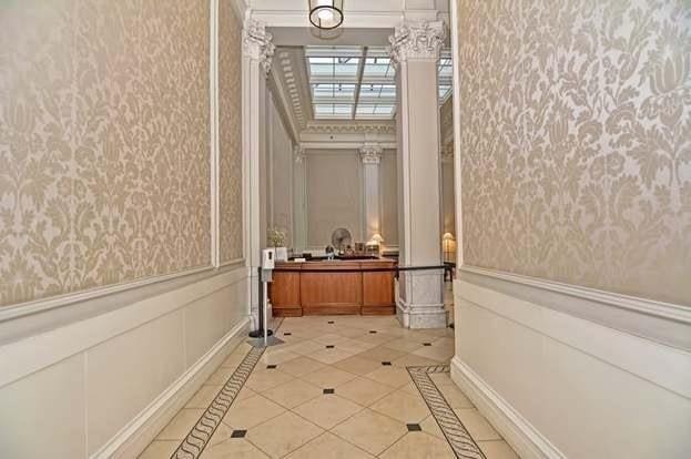 corridor featuring light tile patterned floors