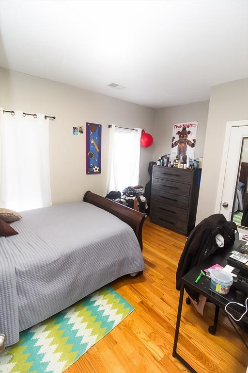 bedroom featuring hardwood / wood-style flooring